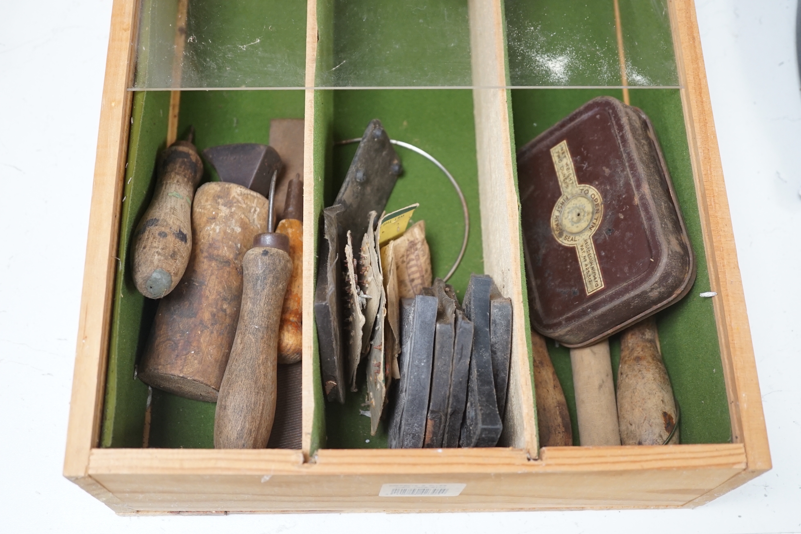 An assorted collection of used 20th century horticultural, shoe making and cooking tools